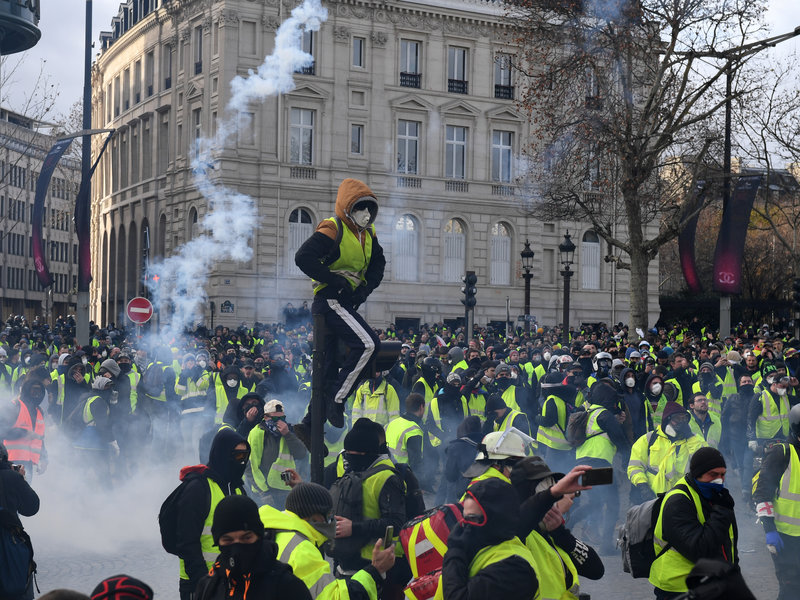 Police Deploy Armored Vehicles Tear Gas Against Paris Protesters Hundreds Detained